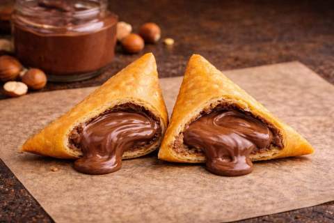 Vegetable samoosas on serving board